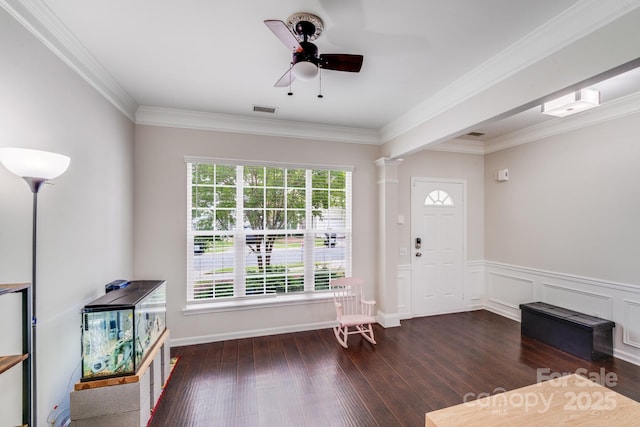 11714 Harsworth Ln, Charlotte, NC 28277 - entrance foyer with hardwood / wood-style floors, ornamental molding, a ceiling fan, a wainscoted wall, and decorative columns