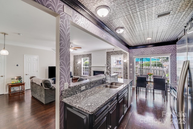 11714 Harsworth Ln, Charlotte, NC 28277 - kitchen with a sink, open floor plan, ornamental molding, dark wood-type flooring, and a fireplace