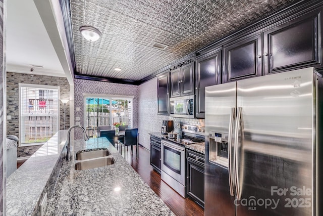 11714 Harsworth Ln, Charlotte, NC 28277 - kitchen with appliances with stainless steel finishes, crown molding, a sink, an ornate ceiling, and dark wood-type flooring