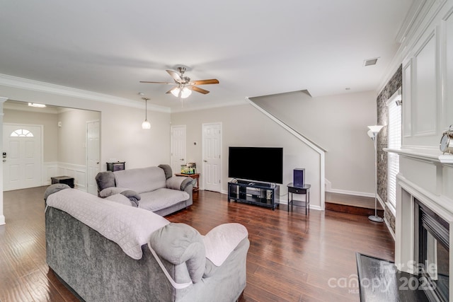 11714 Harsworth Ln, Charlotte, NC 28277 - living area featuring ceiling fan, dark wood-style floors, a fireplace with flush hearth, and ornamental molding