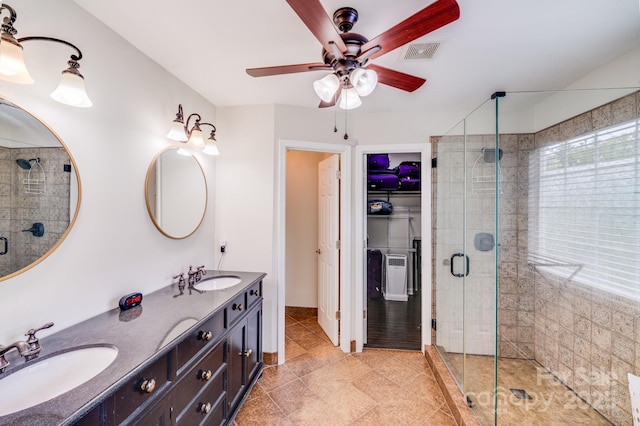 11714 Harsworth Ln, Charlotte, NC 28277 - bathroom featuring a ceiling fan, a stall shower, double vanity, and tile patterned floors