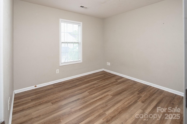 8432 Spirea Ct, Charlotte, NC 28215 - spare room featuring wood finished floors and baseboards