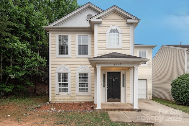 8432 Spirea Ct, Charlotte, NC 28215 - view of front of house with driveway and a garage