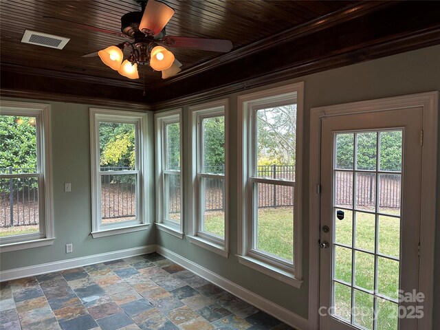 10715 Tom Short Rd, Charlotte, NC 28277 - unfurnished sunroom with baseboards, stone tile floors, and ornamental molding