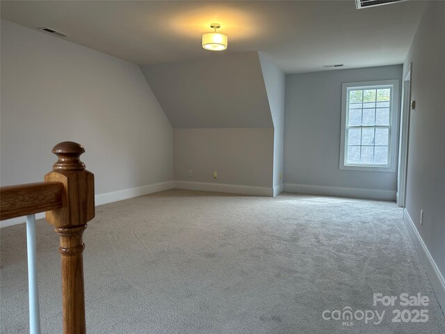 10715 Tom Short Rd, Charlotte, NC 28277 - bonus room featuring carpet, baseboards, and vaulted ceiling