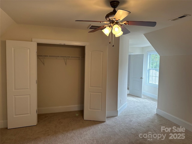 10715 Tom Short Rd, Charlotte, NC 28277 - unfurnished bedroom featuring light colored carpet, a closet, baseboards, and a ceiling fan