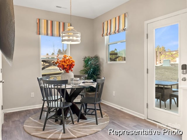 205 Cliffwood St NW Unit Unita-1, Concord, NC 28027 - dining space with baseboards and wood finished floors