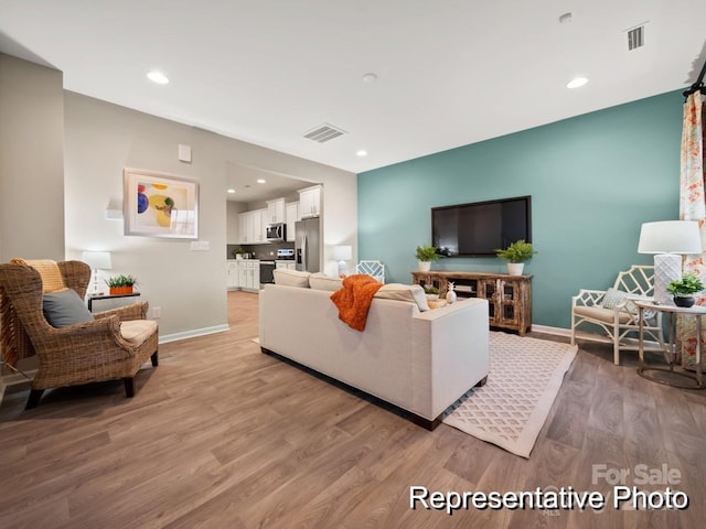 205 Cliffwood St NW Unit Unita-1, Concord, NC 28027 - living area featuring light wood finished floors, baseboards, and recessed lighting