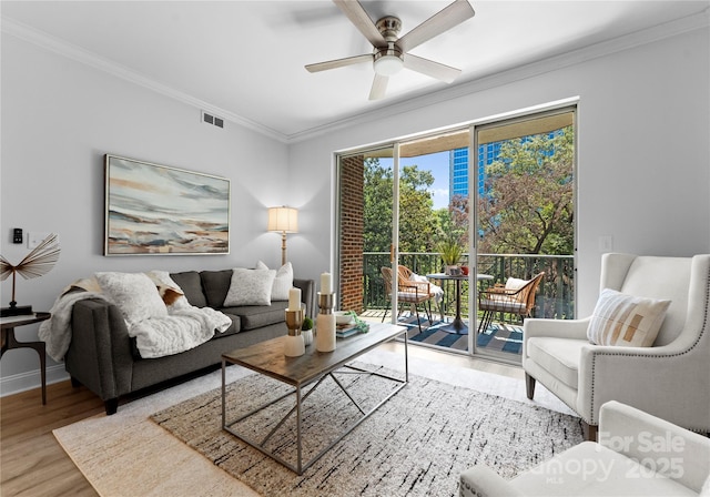 300 W Fifth St Unit 509, Charlotte, NC 28202 - living room with wood finished floors, crown molding, a ceiling fan, and baseboards