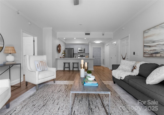 300 W Fifth St Unit 509, Charlotte, NC 28202 - living area with light wood-style floors, ornamental molding, and baseboards