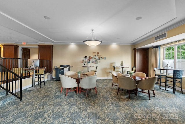 300 W Fifth St Unit 509, Charlotte, NC 28202 - carpeted dining space with crown molding and baseboards