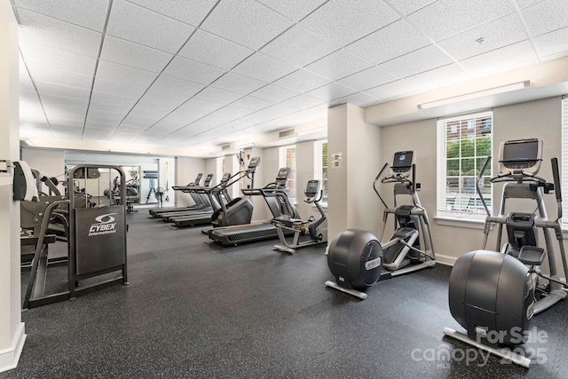 300 W Fifth St Unit 509, Charlotte, NC 28202 - gym featuring a paneled ceiling and baseboards