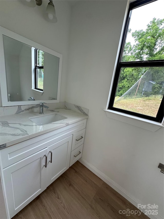 804 3rd Street Pl SW, Hickory, NC 28602 - bathroom featuring wood finished floors, vanity, and baseboards
