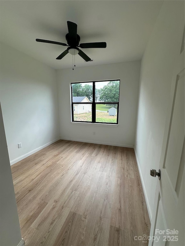 804 3rd Street Pl SW, Hickory, NC 28602 - spare room with wood finished floors, baseboards, and ceiling fan