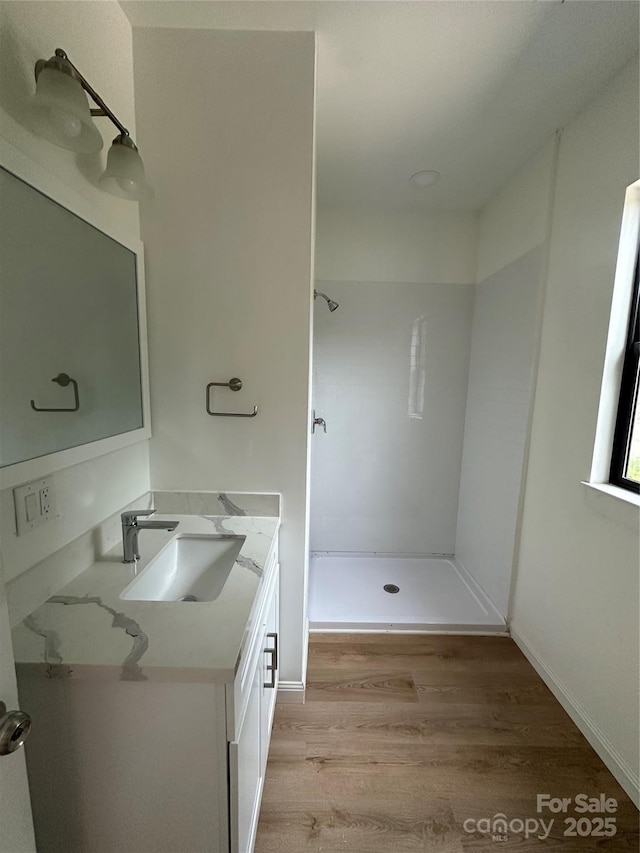 804 3rd Street Pl SW, Hickory, NC 28602 - bathroom featuring vanity, a shower stall, and wood finished floors