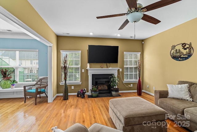 108 Planters Dr, Statesville, NC 28677 - living room with a ceiling fan, wood finished floors, a fireplace with flush hearth, baseboards, and recessed lighting