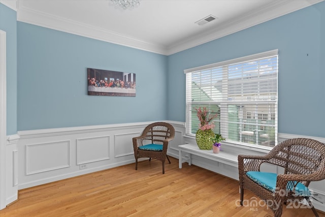 108 Planters Dr, Statesville, NC 28677 - living area with a wainscoted wall, light wood-style floors, and crown molding