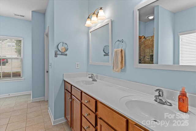 108 Planters Dr, Statesville, NC 28677 - full bath featuring double vanity, tile patterned flooring, baseboards, and tiled shower