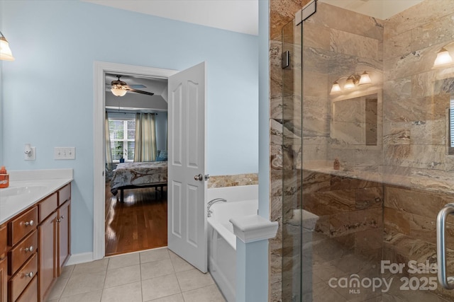 108 Planters Dr, Statesville, NC 28677 - ensuite bathroom featuring a garden tub, a shower stall, vanity, and tile patterned flooring