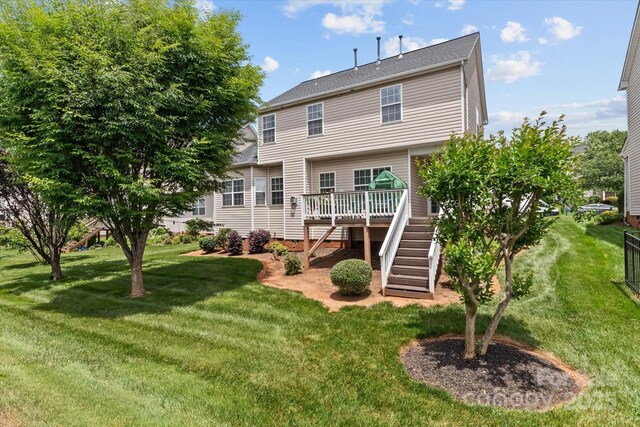 108 Planters Dr, Statesville, NC 28677 - rear view of house featuring stairway, a deck, and a yard