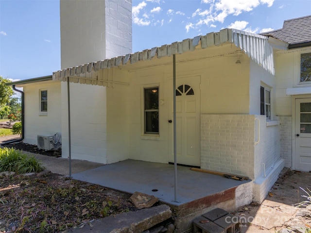 983 Stroud Rd, Ellenboro, NC 28040 - back of house featuring ac unit, brick siding, and a patio