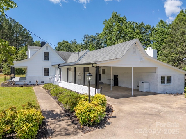 983 Stroud Rd, Ellenboro, NC 28040 - view of front facade featuring a chimney, an attached carport, concrete driveway, a front yard, and a shingled roof