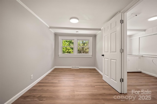 983 Stroud Rd, Ellenboro, NC 28040 - hallway with baseboards, wood finished floors, and crown molding