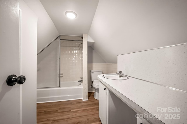 983 Stroud Rd, Ellenboro, NC 28040 - bathroom with toilet, wood finished floors, shower / bathtub combination, vaulted ceiling, and vanity