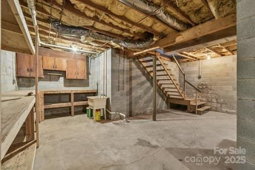 125 Merrill Rd, Fletcher, NC 28732 - unfinished below grade area with a sink and stairs