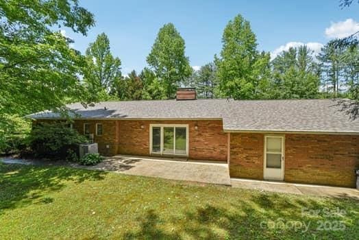 125 Merrill Rd, Fletcher, NC 28732 - back of house with a patio, a yard, and a chimney