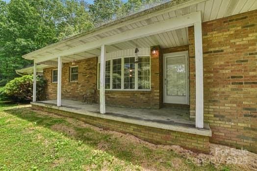 125 Merrill Rd, Fletcher, NC 28732 - entrance to property with covered porch and brick siding
