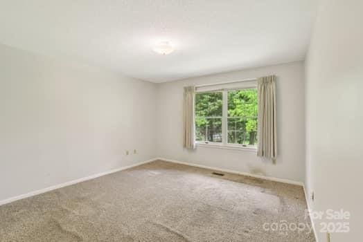 125 Merrill Rd, Fletcher, NC 28732 - carpeted empty room featuring baseboards