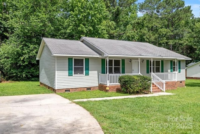 2223 Pacer Rd, Lancaster, SC 29720 - view of front facade featuring crawl space, covered porch, roof with shingles, and a front lawn