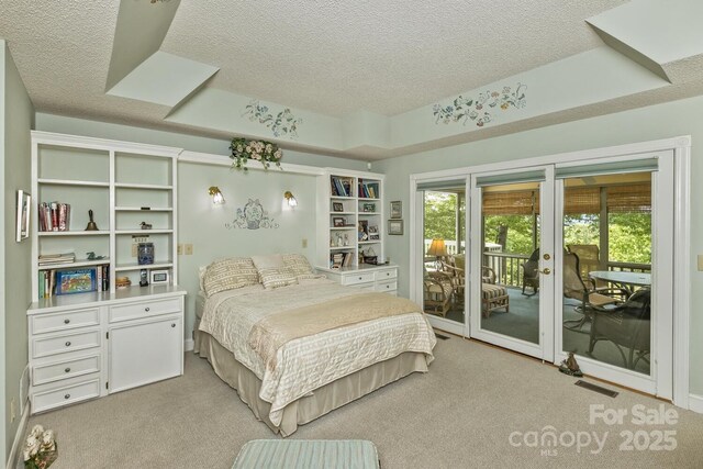 4471 Cove Loop Rd, Hendersonville, NC 28739 - carpeted bedroom featuring a textured ceiling and access to exterior