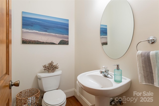 75 Cougar Ln, Saluda, NC 28773 - bathroom with toilet, a sink, and baseboards