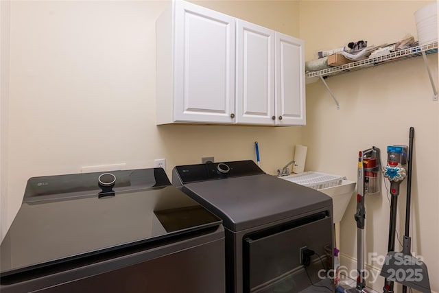 75 Cougar Ln, Saluda, NC 28773 - laundry area featuring cabinet space and washer and clothes dryer