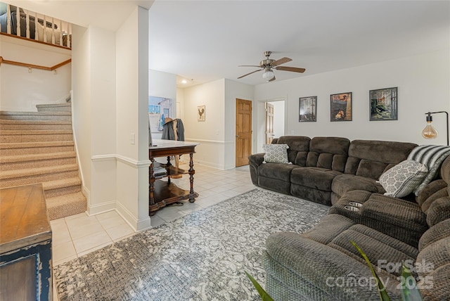 75 Cougar Ln, Saluda, NC 28773 - tiled living room with ceiling fan, stairway, and baseboards