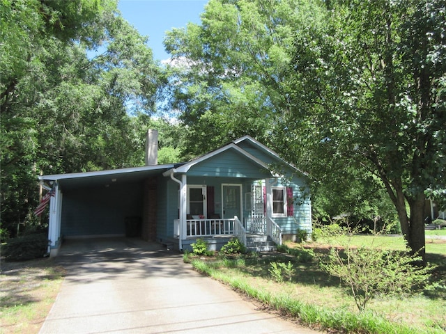 1051 S Brady Ave, Newton, NC 28658 - view of front facade featuring covered porch, concrete driveway, and an attached carport
