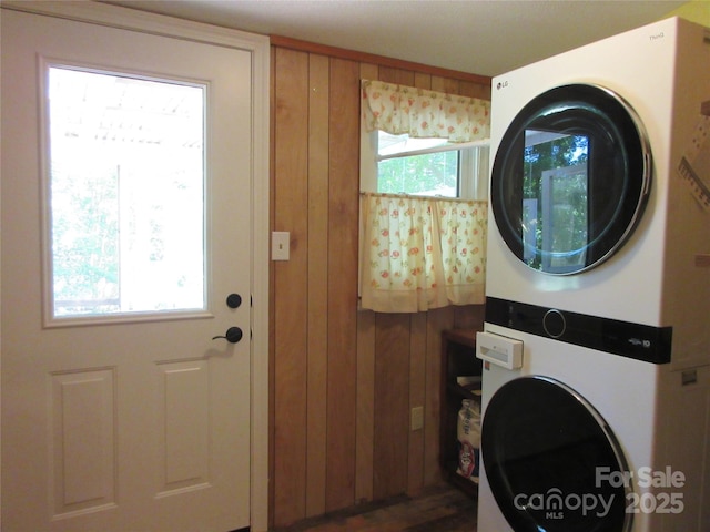 1051 S Brady Ave, Newton, NC 28658 - laundry room with stacked washing machine and dryer and wooden walls