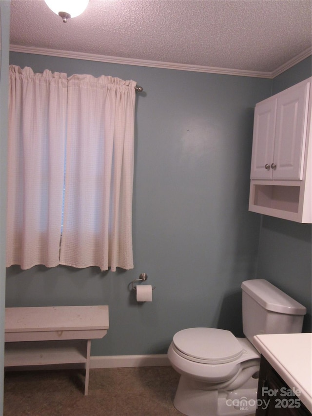 1051 S Brady Ave, Newton, NC 28658 - bathroom featuring a textured ceiling, toilet, ornamental molding, vanity, and baseboards