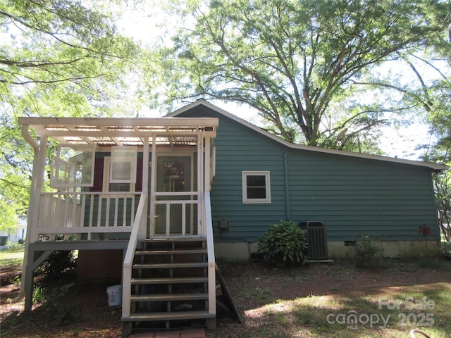 1051 S Brady Ave, Newton, NC 28658 - back of property featuring crawl space, cooling unit, a sunroom, and a pergola