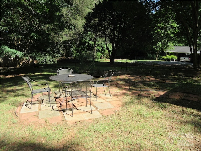 1051 S Brady Ave, Newton, NC 28658 - view of green lawn featuring a patio and outdoor dining space