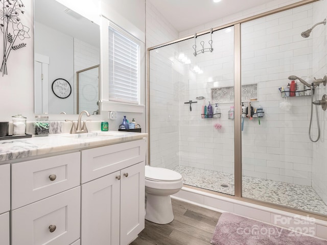 805 Brookmont Ave, Salisbury, NC 28146 - full bathroom with toilet, a shower stall, vanity, and wood finished floors