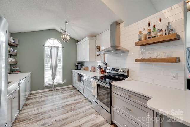 4712 Avalon Forest Ln, Charlotte, NC 28269 - kitchen with wall chimney exhaust hood, stainless steel appliances, open shelves, lofted ceiling, and light wood-style floors