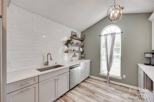 4712 Avalon Forest Ln, Charlotte, NC 28269 - kitchen featuring dishwasher, a sink, light countertops, vaulted ceiling, and a textured ceiling