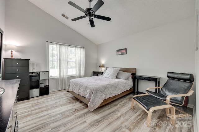4712 Avalon Forest Ln, Charlotte, NC 28269 - bedroom with light wood finished floors, high vaulted ceiling, baseboards, and a ceiling fan