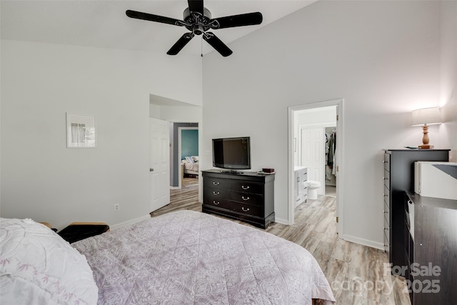 4712 Avalon Forest Ln, Charlotte, NC 28269 - bedroom featuring baseboards, light wood-type flooring, high vaulted ceiling, ceiling fan, and connected bathroom