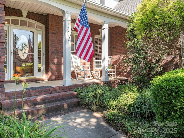 725 Old State St SW, Concord, NC 28027 - doorway to property with a porch, brick siding, and a shingled roof