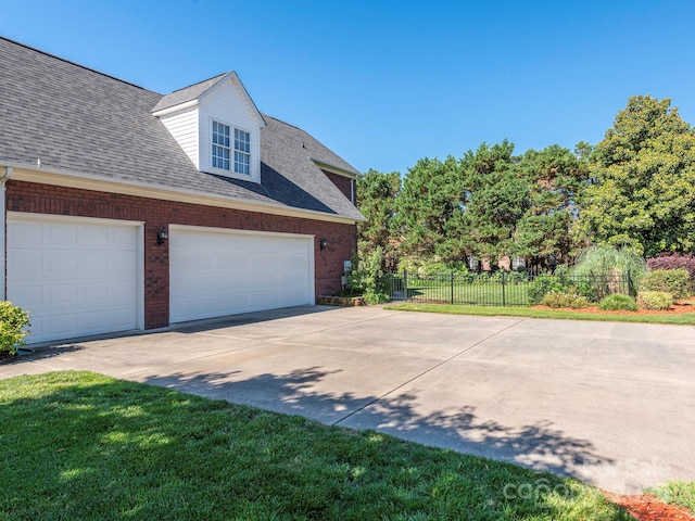 725 Old State St SW, Concord, NC 28027 - view of property exterior featuring brick siding, driveway, and a shingled roof