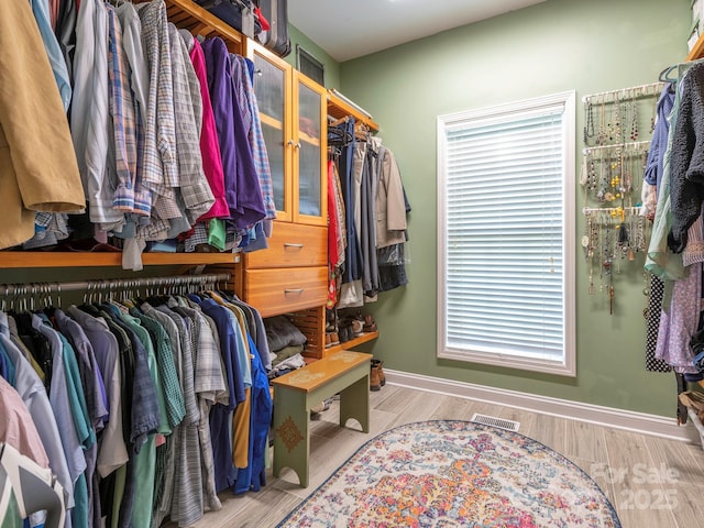 725 Old State St SW, Concord, NC 28027 - walk in closet with wood finished floors